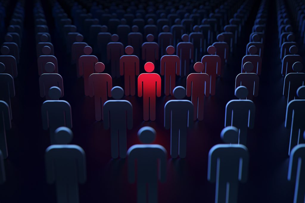 Représentation de'une personne mise en évidence grâce à un système de réputation. Il montre une foule de personnages en bâtonnets, dont l'un est surligné en rouge au centre.